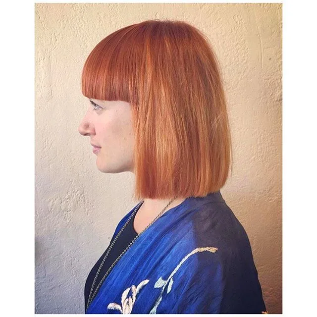 Coppery-ginger blunt bob with heavy blunt fringe